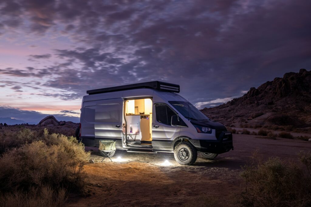 Van with door open at dusk